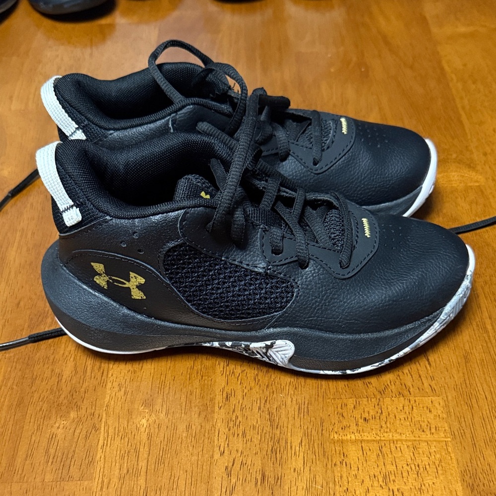 Under Armour Kids Sneakers in Black with Gold Accents
